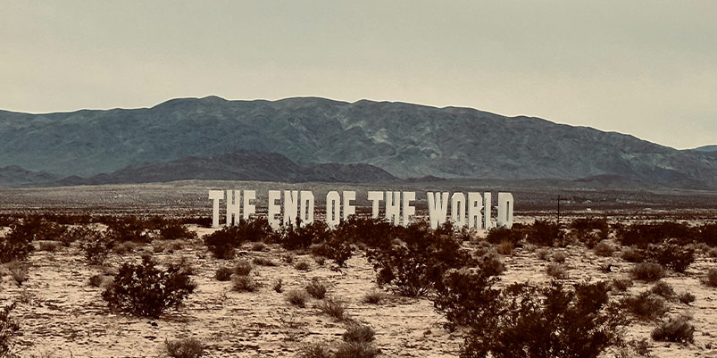 Large letters reminiscent of the Hollywood sign in the Mojave desert spell "The End of the World."